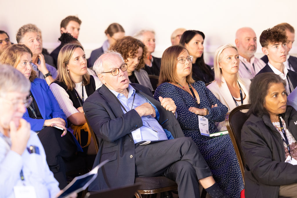 A full audience listening to a session